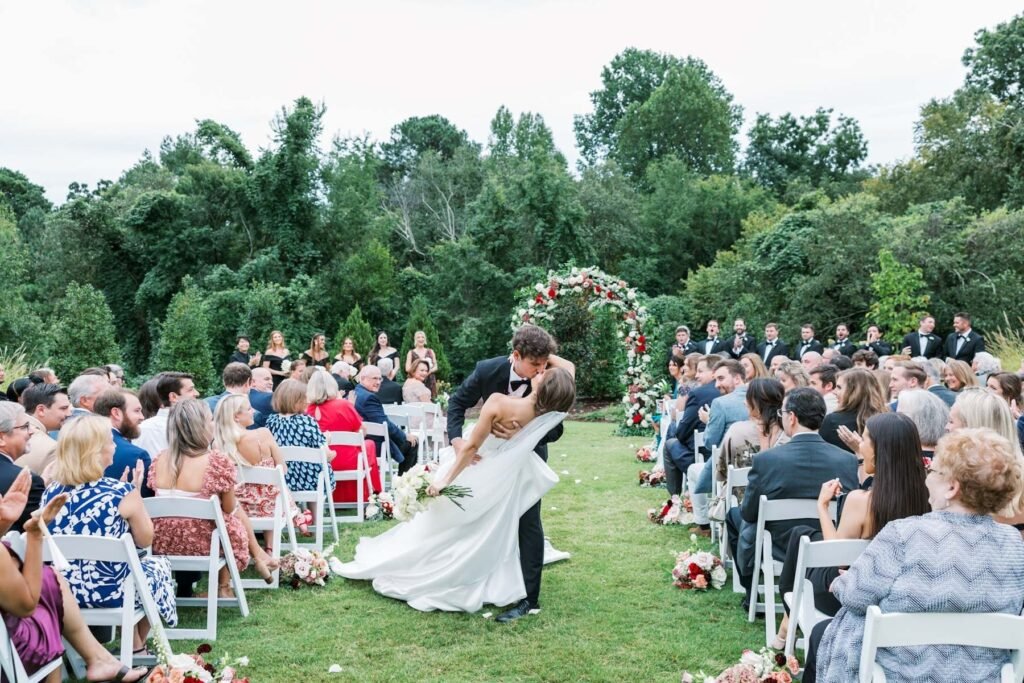 couple having their first kiss at the Maxwell - Stylus Wedding DJs - Wedding at the Maxwell in Raleigh North Carolina