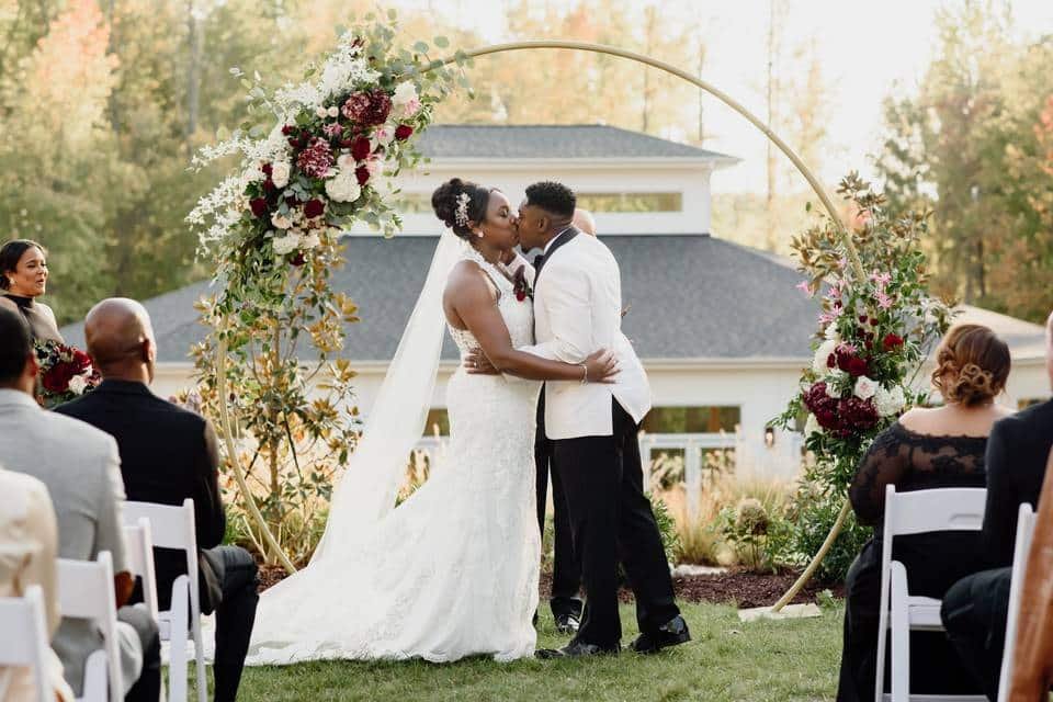 couple having their first kiss at the Upchurch in Cary North Carolina - Stylus Wedding DJs - Wedding at the Upchurch in Cary North Carolina